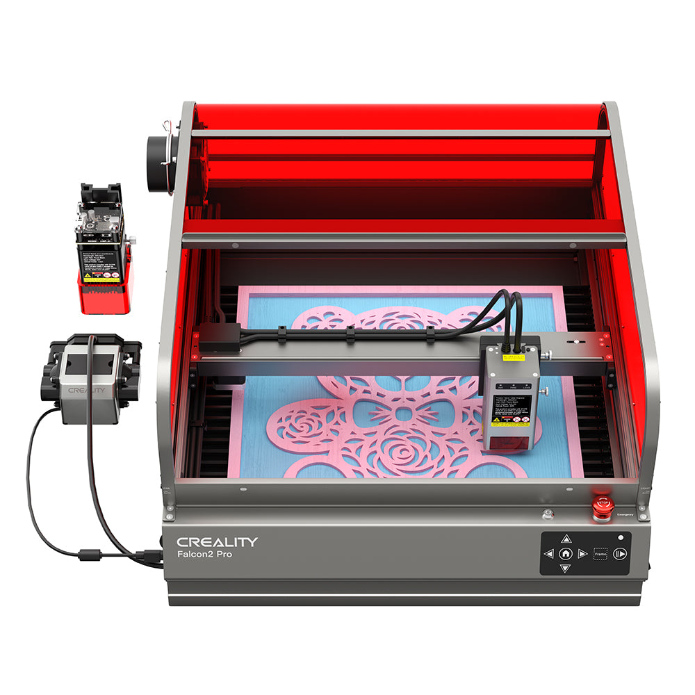 The CrealityFalcon Falcon2 Pro 22W/40W Enclosed Laser Engraver and Cutter is actively printing a detailed design. The machine has a red protective enclosure, a control panel at the front, and a power supply box connected to the left side, ensuring precise positioning and FDA Class 1 safety standards.