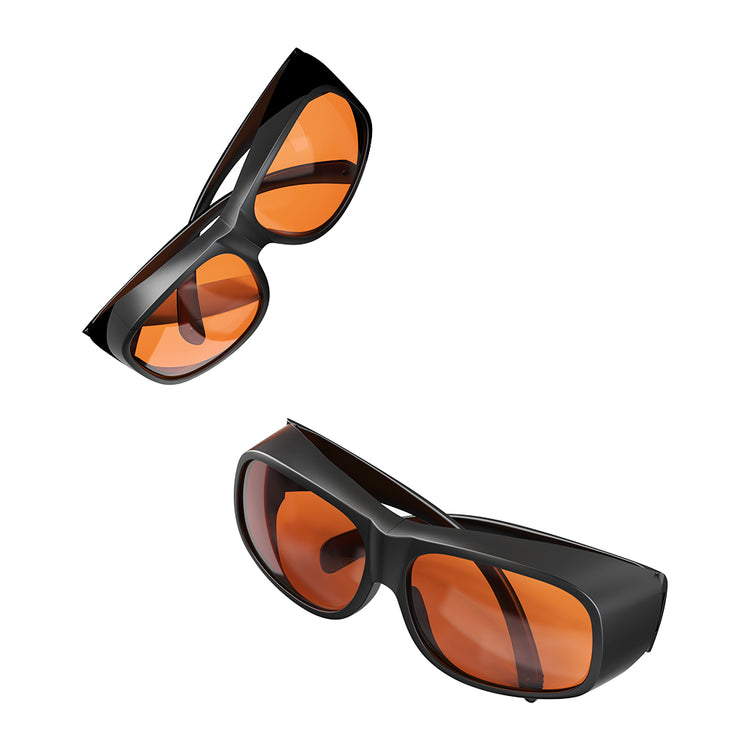 A pair of CrealityFalcon Falcon Laser Safety Glasses_180-534nm, featuring black, wraparound frames with large, rectangular, orange-tinted lenses. The design includes wide arms and a sleek, modern look that provides protection for wavelengths between 180-534nm. Ideal for nearsighted individuals, the glasses are displayed against a white background.