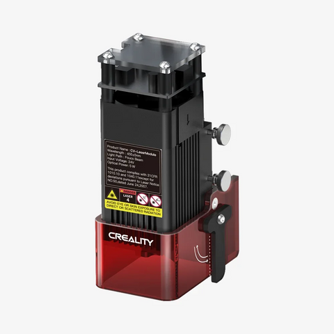 A red and black CrealityFalcon Laser Module, compatible with Ender-3 and other suitable Creality3D printers, featuring a detailed product label on the rear side. The laser module includes specifications such as wavelength and optical power, has multiple vents at the top, and a clamp mechanism on the side. Available in 1.6W/5W/10W power options.