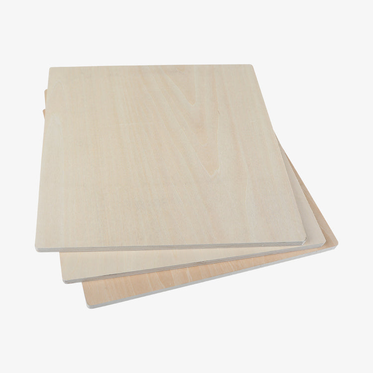 A stack of CrealityFalcon Basswood Plywood Sheets 11.8" x 11.8" for Laser Engraving is arranged in a slightly fanned-out manner. The rectangular panels, with smooth surfaces made of thin, unfinished wood, would be ideal for DIY projects. In this arrangement, the edges of each sheet are clearly visible. Available in packs of 10pcs, 6pcs, and 3pcs.