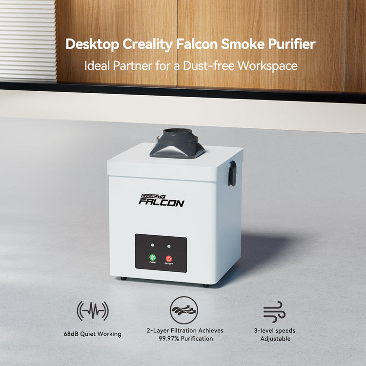 A white CrealityFalcon Falcon Desktop Smoke Purifier for Falcon A1 sits on an office floor, featuring quiet 68dB operation, 2-layer filtration for 99.7% purification, and three adjustable speed settings.