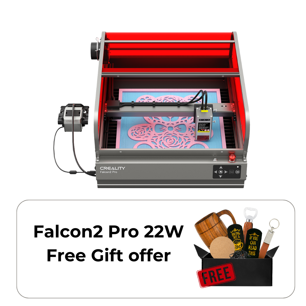 The CrealityFalcon Falcon2 Pro 22W/40W Enclosed Laser Engraver and Cutter is actively printing a detailed design. The machine has a red protective enclosure, a control panel at the front, and a power supply box connected to the left side, ensuring precise positioning and FDA Class 1 safety standards.