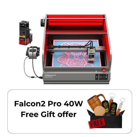 The CrealityFalcon Falcon2 Pro 22W/40W Enclosed Laser Engraver and Cutter is actively printing a detailed design. The machine has a red protective enclosure, a control panel at the front, and a power supply box connected to the left side, ensuring precise positioning and FDA Class 1 safety standards.