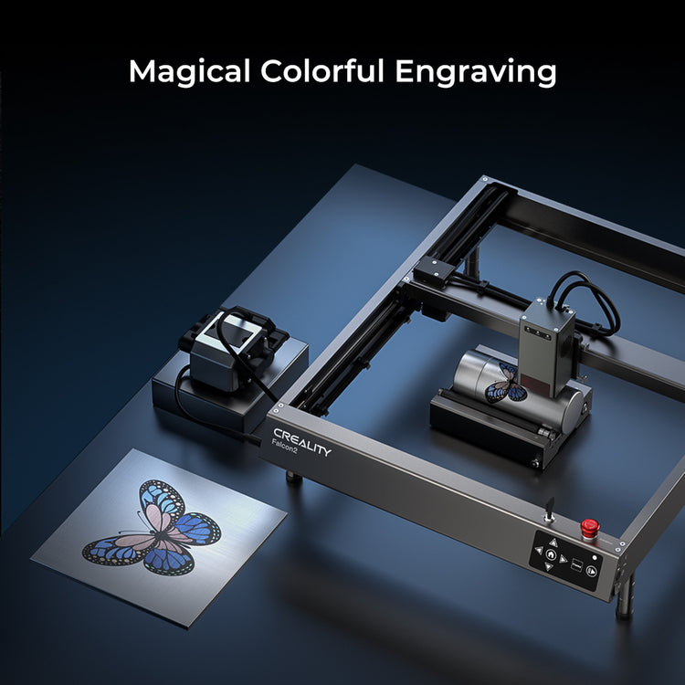 A 3D laser engraving machine is shown engraving a colorful butterfly design onto a metal plate. The "CrealityFalcon" branded machine, known as the Falcon2 22W Laser Engraver and Cutter, boasts 22W cutting power and an integrated air assist, enhancing the "Magical Colorful Engraving" process to be both fast and productive.