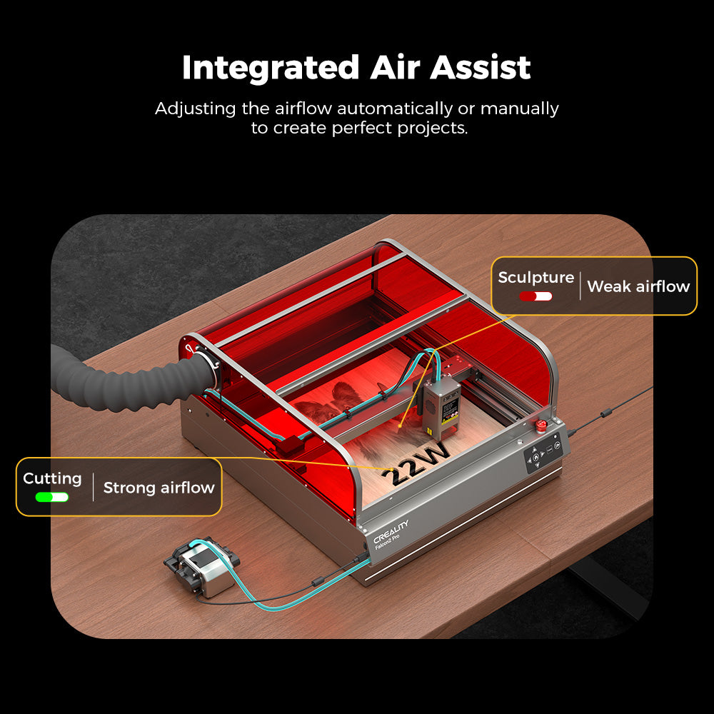 On a wooden table, the CrealityFalcon Falcon2 Pro 22W/40W Enclosed Laser Engraver and Cutter is displayed, featuring a red protective cover and an integrated air assist system. Labels highlight that the system adjusts airflow for cutting with strong airflow and for sculpting with weak airflow. This model, known as the 22W variation, boasts a sleek visual design.