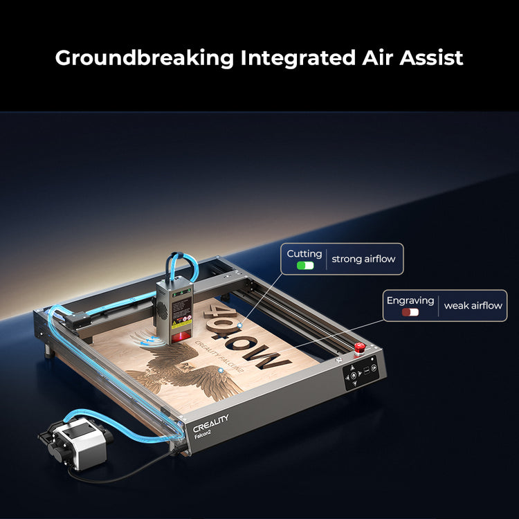An image showcasing the CrealityFalcon Falcon2 40W Laser Engraver and Cutter with the caption "Groundbreaking Integrated Air Assist." The machine, featuring a powerful 40W laser output, is engaged in a project with labels distinguishing between strong airflow for cutting and weak airflow for engraving.
