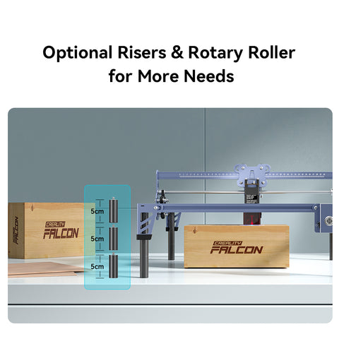 A CR-Laser Falcon 5W Laser engraver from CrealityFalcon, renowned as one of the best laser engravers available, is displayed with optional risers and a rotary roller. It sits beside wooden blocks engraved with "Creality Falcon." The risers can extend the height incrementally in 5 cm intervals.